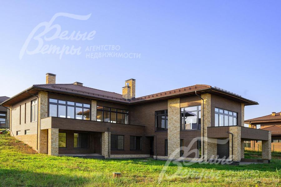 Облицован клинкерным кирпичом