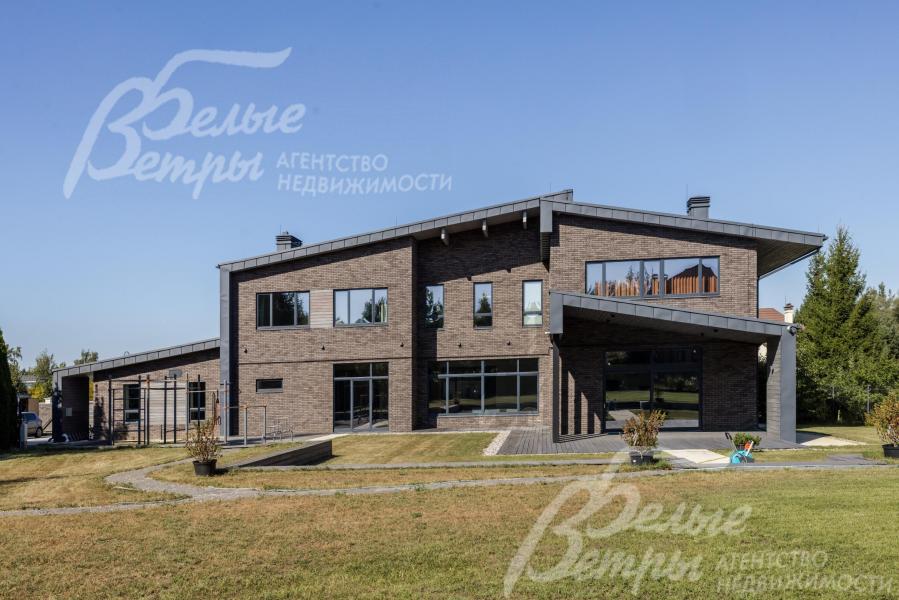 Двухуровневый коттедж на участке 29 соток