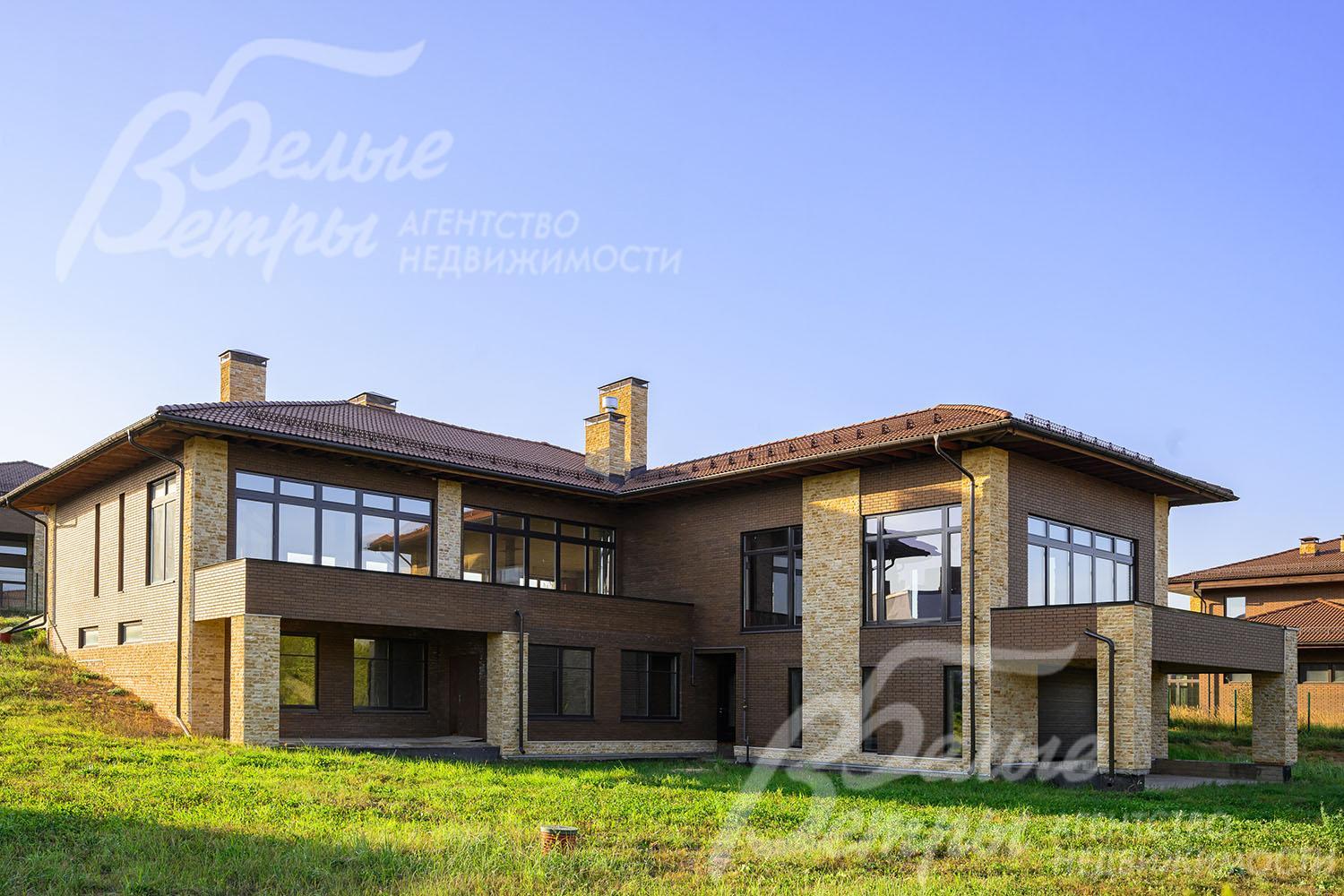 Облицован клинкерным кирпичом