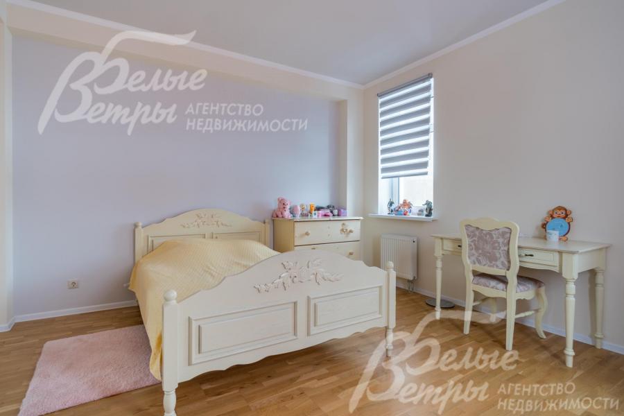 Одна из спален в коттедже