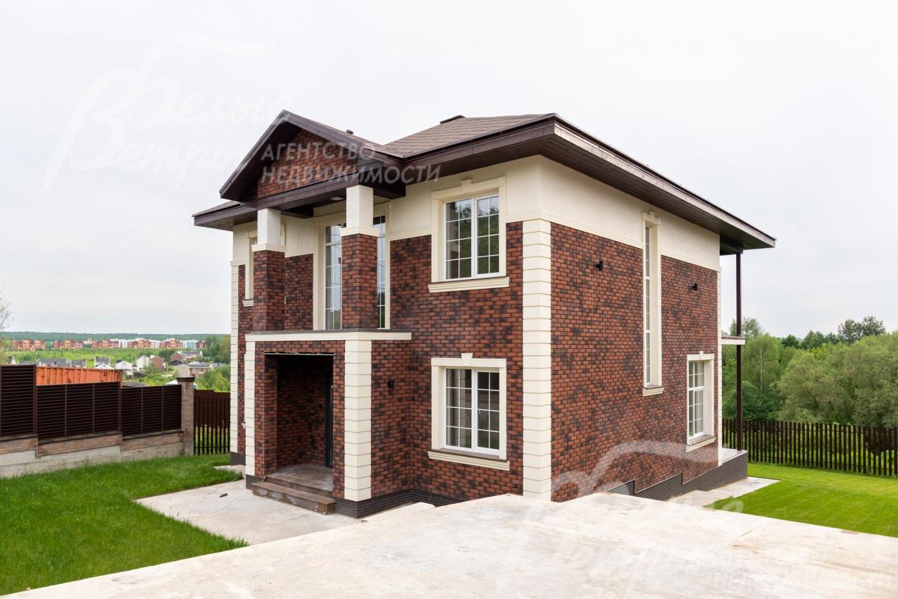 Облицовка фасада - термопанели с темной клинкерной плиткой и штукатурка Короед. 