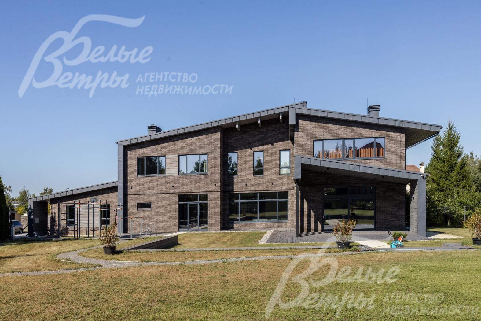 Двухуровневый коттедж на участке 29 соток